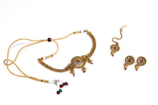 Traditional Gold  Plated Floral Jewellery Set: Ornate Floral Necklace, Earrings, and Maangtika with Ruby Accent -Artificial Jewelry For Women And Girls - Buy Online at The Laxmi Company