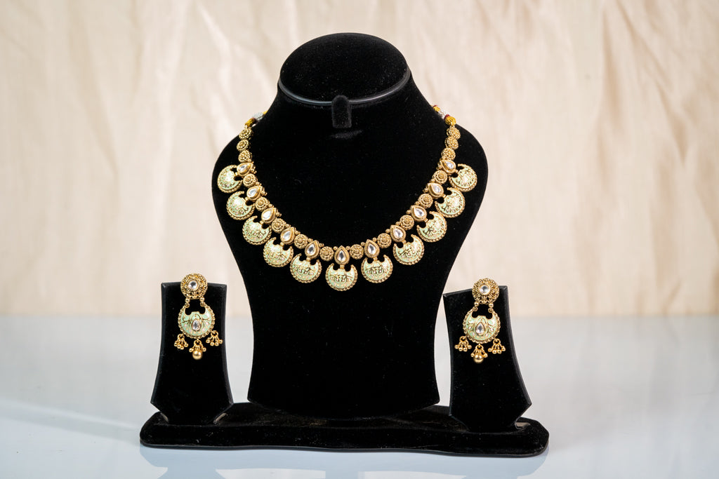 Regal Antique Kundan-Style Choker with Matching Earrings Set: Luxurious Gold-Toned Artificial Jewelry for Women -Buy Online at The Laxmi Collection