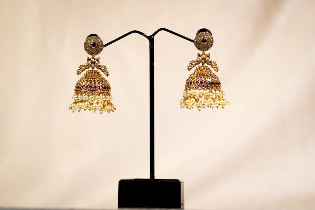 Gold Jhumka Earrings with Pearl Cluster and Ruby Accents